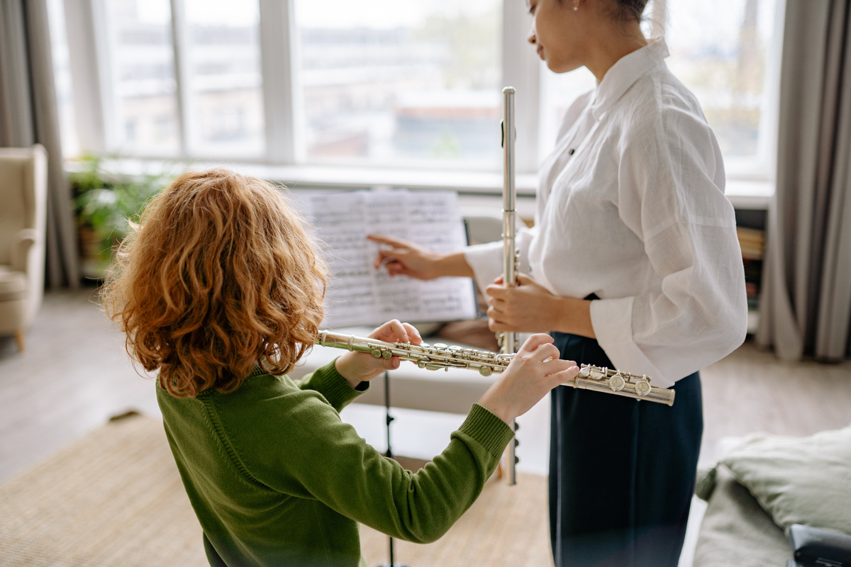 Music Teacher Teaching a Child